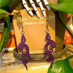 Purple swirly earrings.